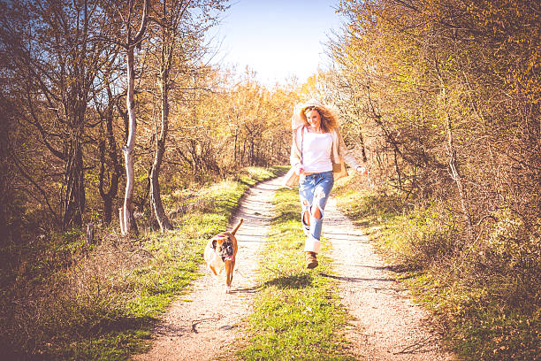 istock Young woman with dog 518533832
