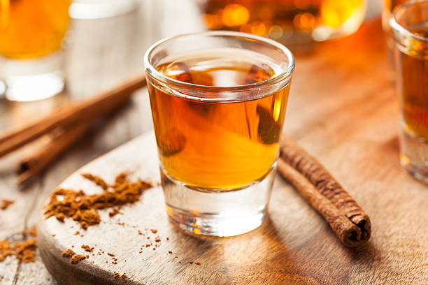 istock Cinnamon Whiskey Bourbon in a Shot Glass 518536360