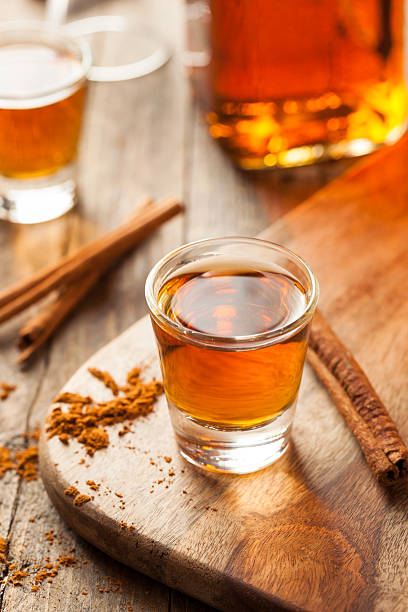 istock Cinnamon Whiskey Bourbon in a Shot Glass 518536400