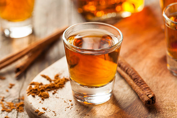 istock Cinnamon Whiskey Bourbon in a Shot Glass 518536428