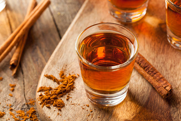 istock Cinnamon Whiskey Bourbon in a Shot Glass 518536592