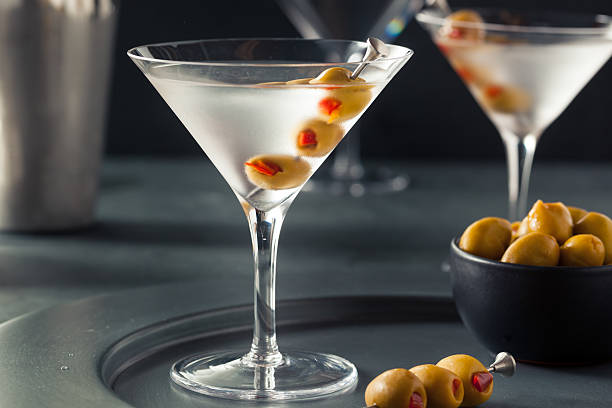 Classic Shaken Dry Vodka Martini Classic Shaken Dry Vodka Martini with Olives martini stock pictures, royalty-free photos & images