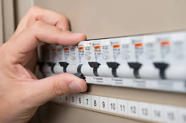 Photo of Electrician Testing The Switchboard