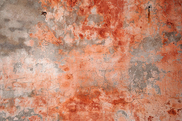 istock Texture of old wall covered with pink stucco 518547993