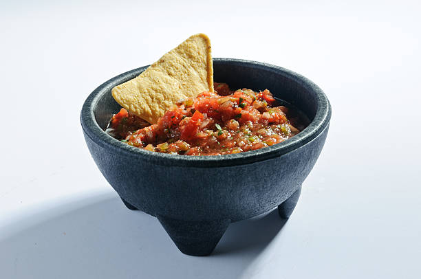istock Mexican salsa bowl with tortilla chip 518549411
