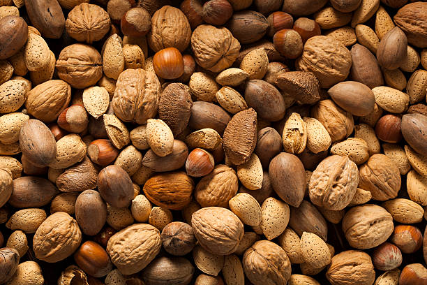 istock Assortment of Whole Raw Mixed Nuts 518549477