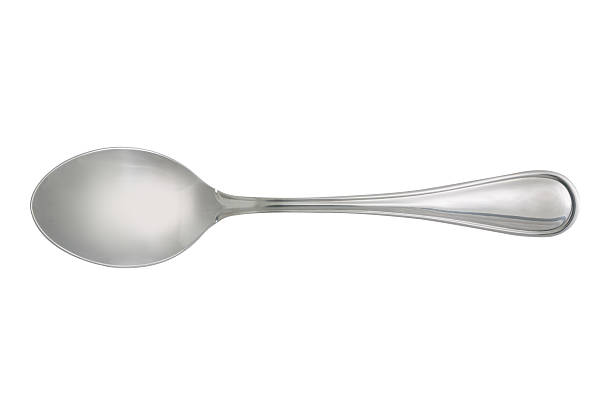 dessert spoon isolated on white background dessert spoon isolated on white background,  file includes a excellent clipping path spoon stock pictures, royalty-free photos & images