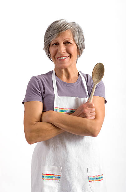 Senior lady holding a wooden spoon