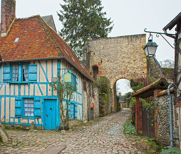 istock Old street in medieval village. 518553511