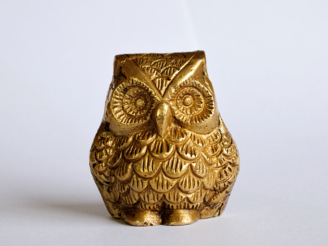 Straight face of brass owl
