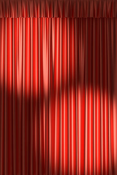 istock Red theater curtain under two spot lights 518553987