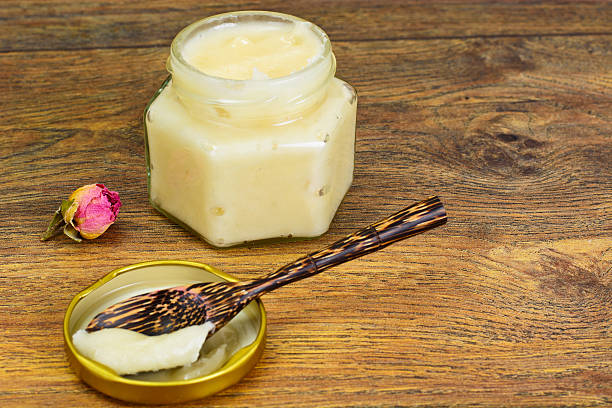 istock Glass Jar with Cream Honey Bee 518555056