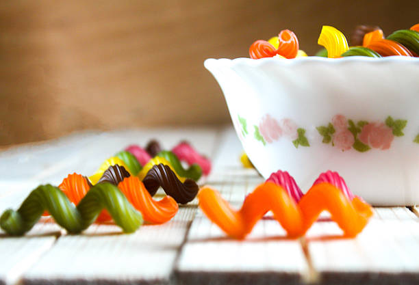 istock multicolored pasta lying on a wooden table 518555918