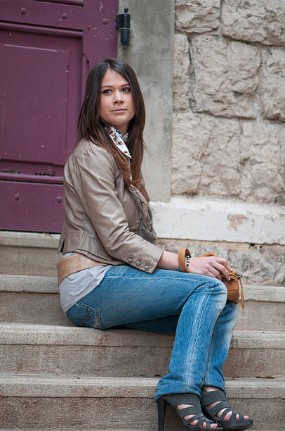 istock Beautiful Young Woman Sitting 518556460