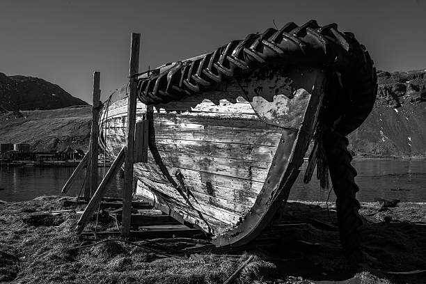 istock Mono abandoned rowing boat on wooden blocks 518557392