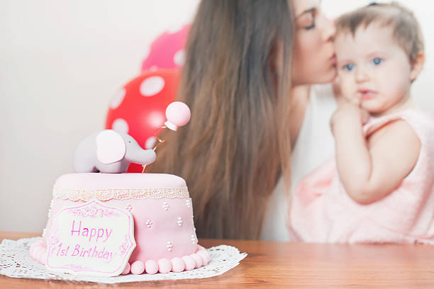 Mother With Funny Baby Celebrating First Birthday Cake Stock Photo -  Download Image Now - iStock