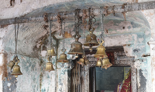 Temple bells in a Hindu temple in India, people ring bells before offering prayers to the gods, it is believed that sound of temple bells helps in emptying the thoughts of mind