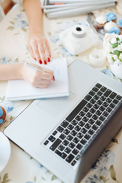 istock female hands busy typing on a laptop 518558238