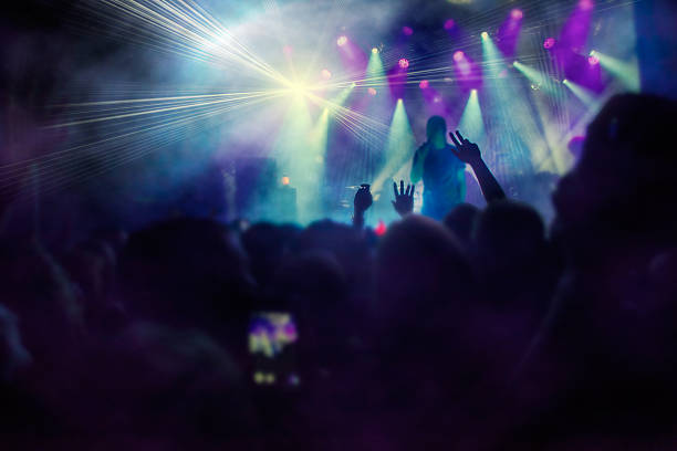 istock Silhouettes of people and musicians 518558986