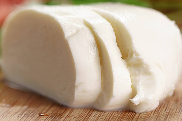 istock sliced ball of mozzarella cheese 518559144
