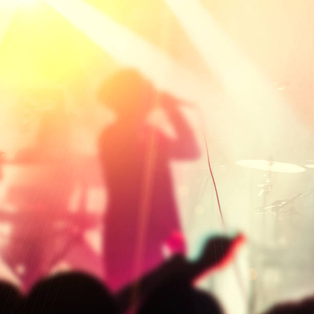 istock Silhouettes of people and musicians 518559464