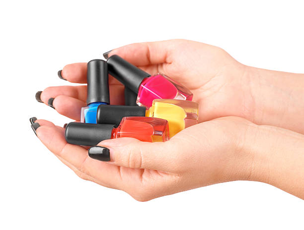 istock woman hands with nail polishes 518561492