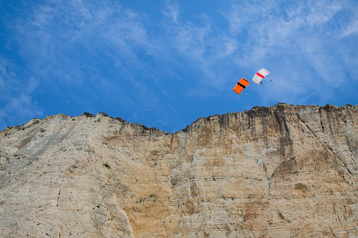Parachute jump from a cliff