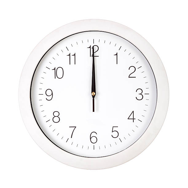 White clock face showing twelve o'clock stock photo