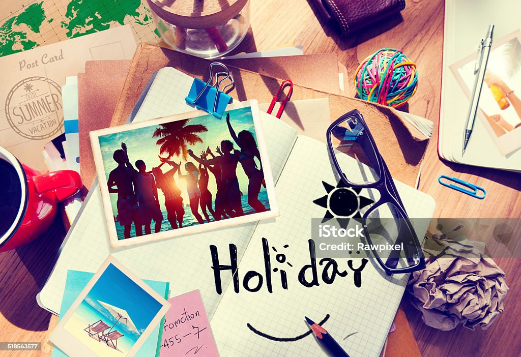 Desk with Summer Photographs and Notebook Adhesive Note Stock Photo