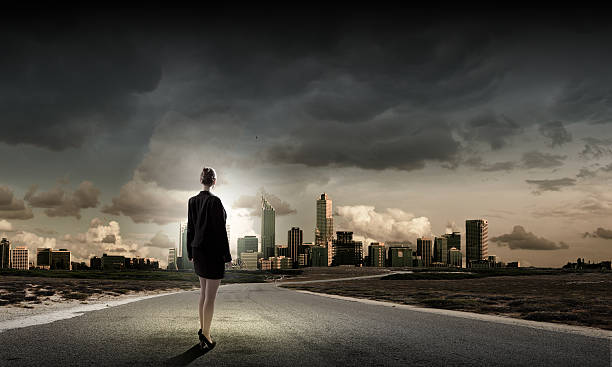 istock Businesswoman on road 518563639