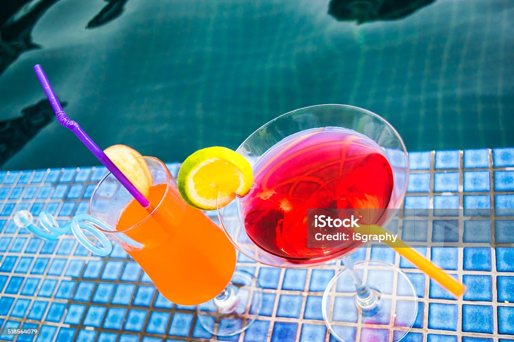 Cocktails at poolside Cocktail at poolside Blue Stock Photo