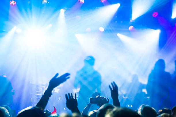 istock Silhouettes of people and musicians 518564112