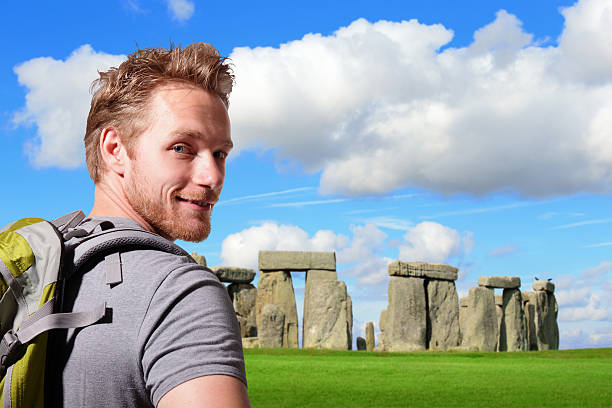 istock Young man travel in stonehenge 518564121