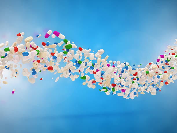 istock Wave from Colorful Medical Pills on blue background 518565307