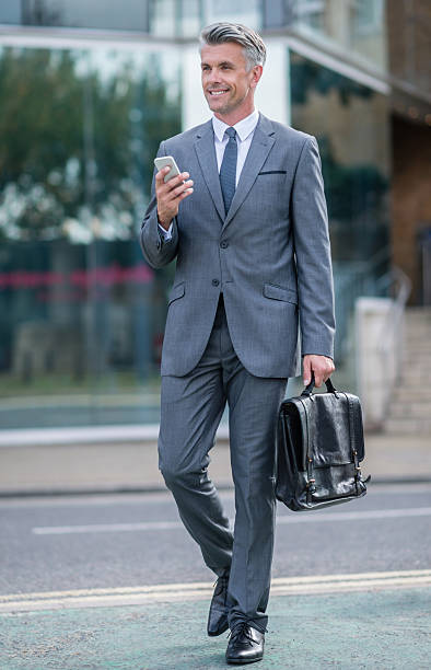 istock Business man walking outdoors 518567205