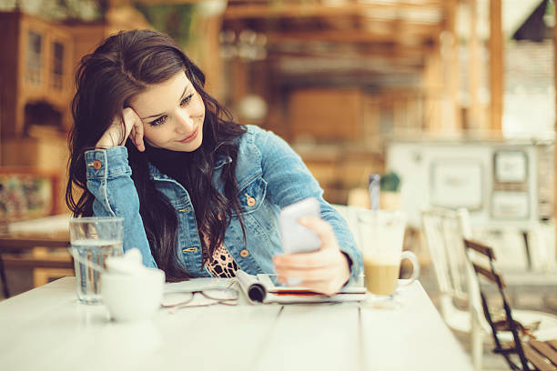 istock Pretty and young designer in a coffee shop 518567231