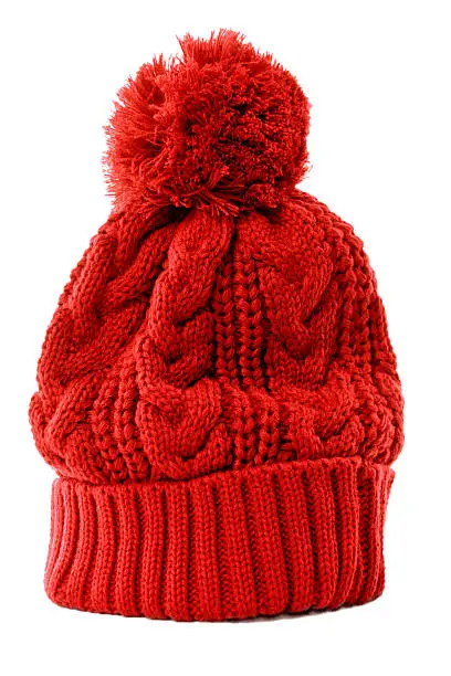 Red bobble hat or knit hat isolated against a white background.