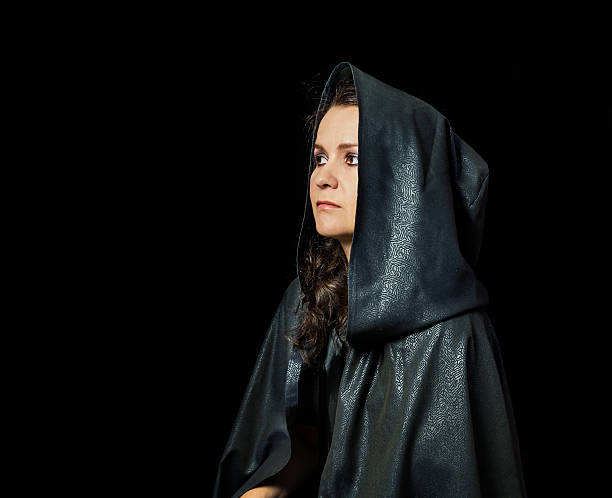 istock Girl in black mantle 518568035