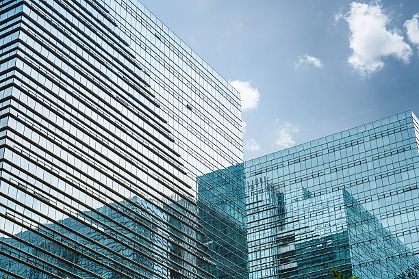 istock modern glass skyscraper under the blue sky 518570057