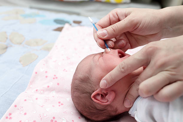 istock Cleaning the nose a baby 518586096