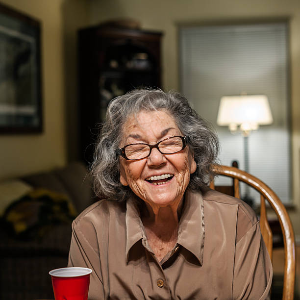 istock Senior Woman Closing Her Eyes Making Funny Face 518586422