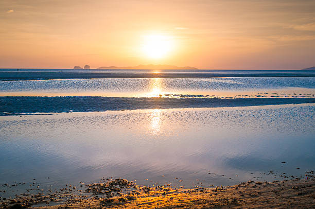 istock Beautiful sand beach with the sunset  sky. 518586426