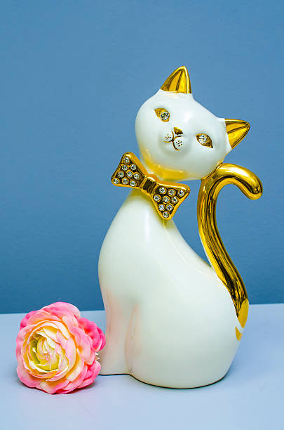 statue of cat and flower
