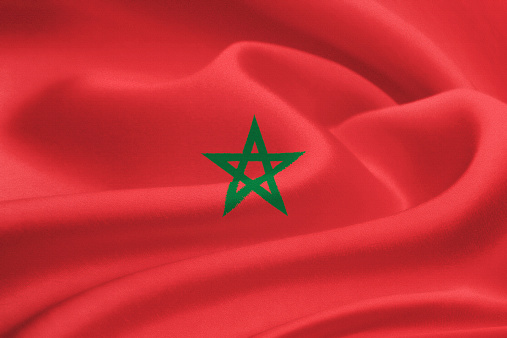 flag of Morocco waving in the wind. Silk texture pattern
