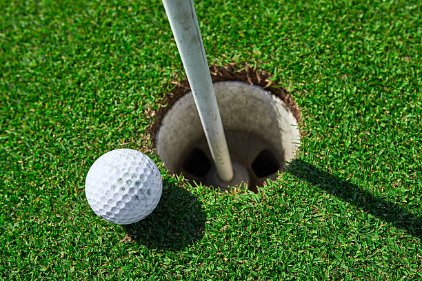 istock golf ball near the hole 518587822