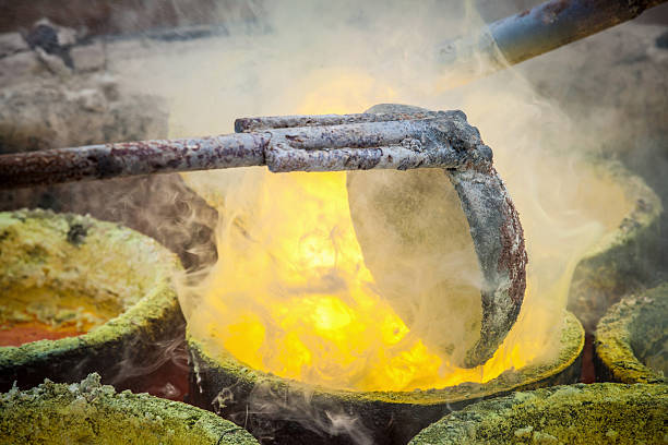 istock Foundry - molten metal poured from ladle 518588220