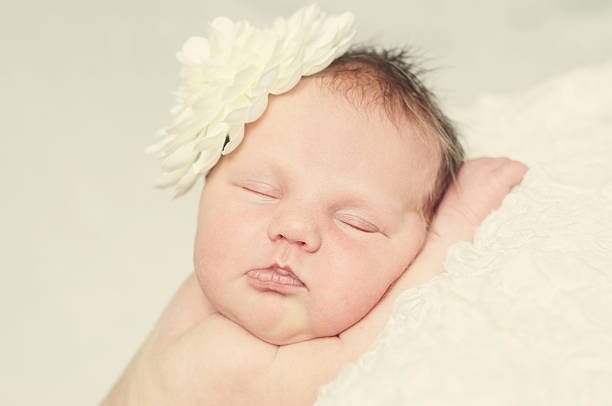 Newborn Baby Girl Sleeping Peacefully stock photo