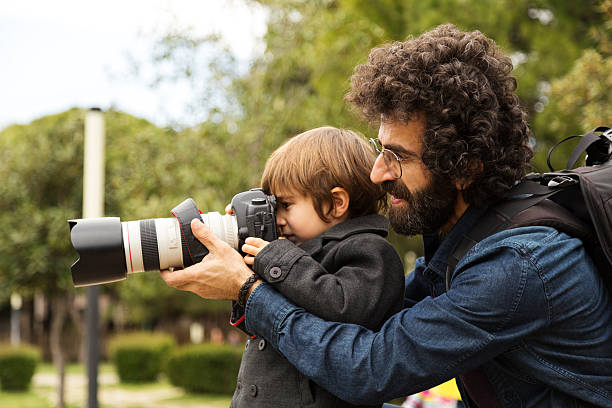 istock Photographer Father And His Son 518588484