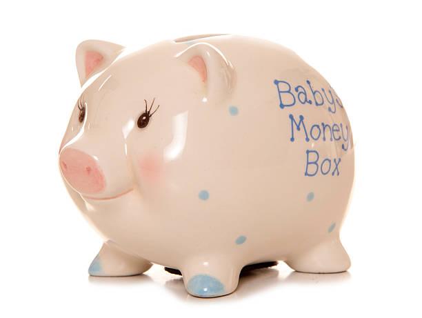 istock Babys first money box piggy bank 518588909