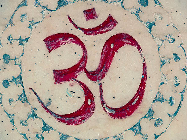 istock Holy character OM is carved and painted in marble 518589697